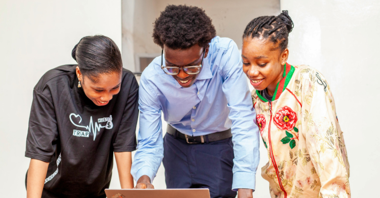 A small accountability group collaborating on goals — the foundation of a mastermind group